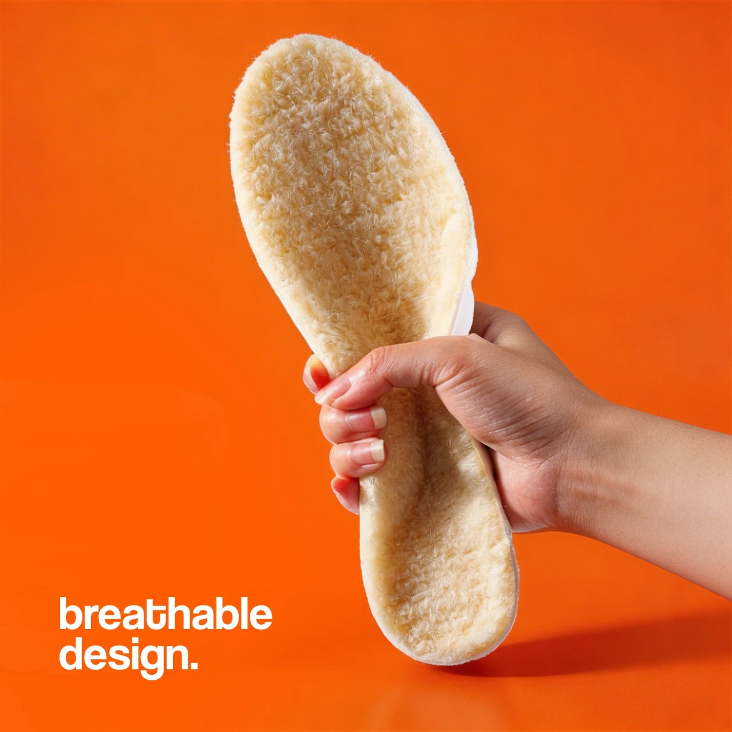 Cashmere Insoles held by a hand highlighting a soft, breathable design.