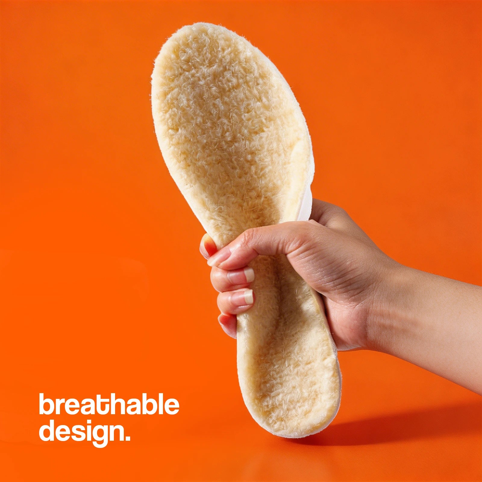 Cashmere Insoles held by a hand highlighting a soft, breathable design.
