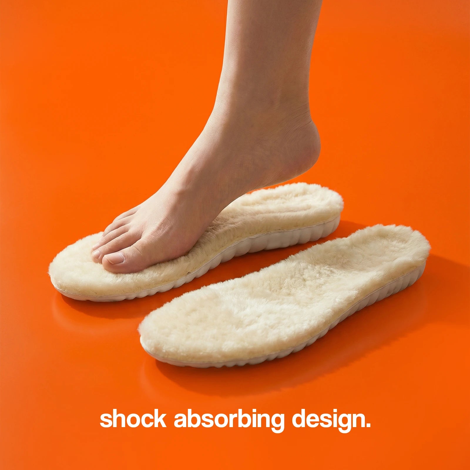 Foot wearing a pair of shock-absorbing insoles on an orange background
