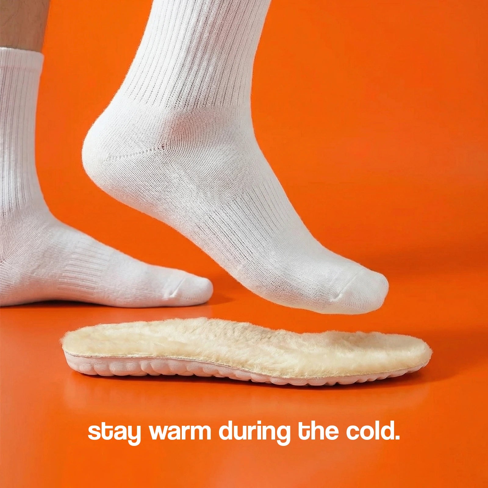 White socks and a beige insole on an orange background with text 'stay warm during the cold'.