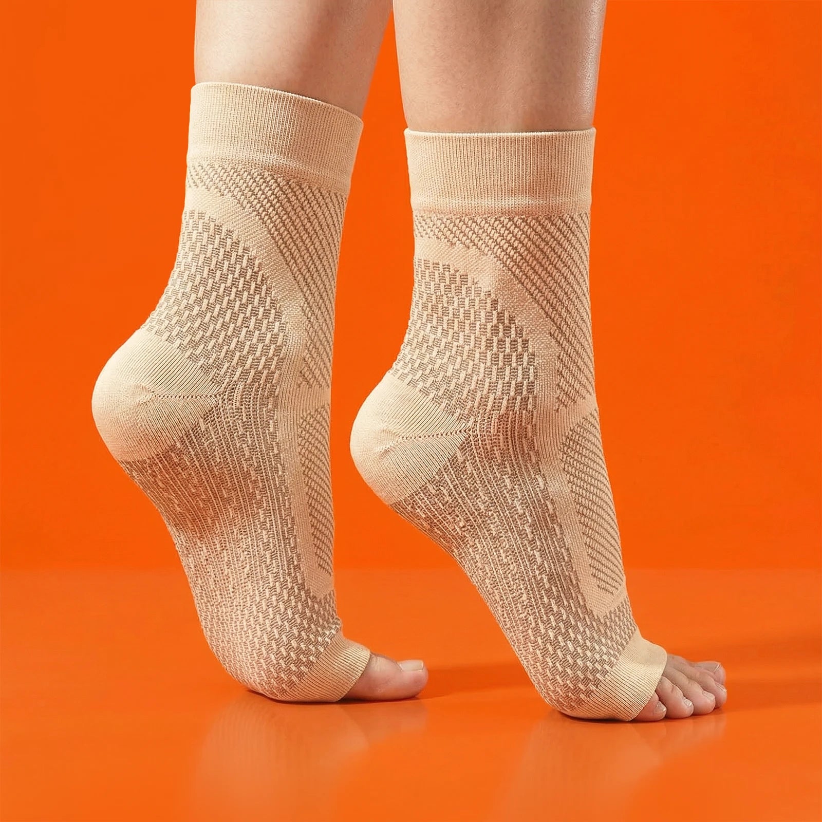 Beige ankle socks worn by a person on an orange background