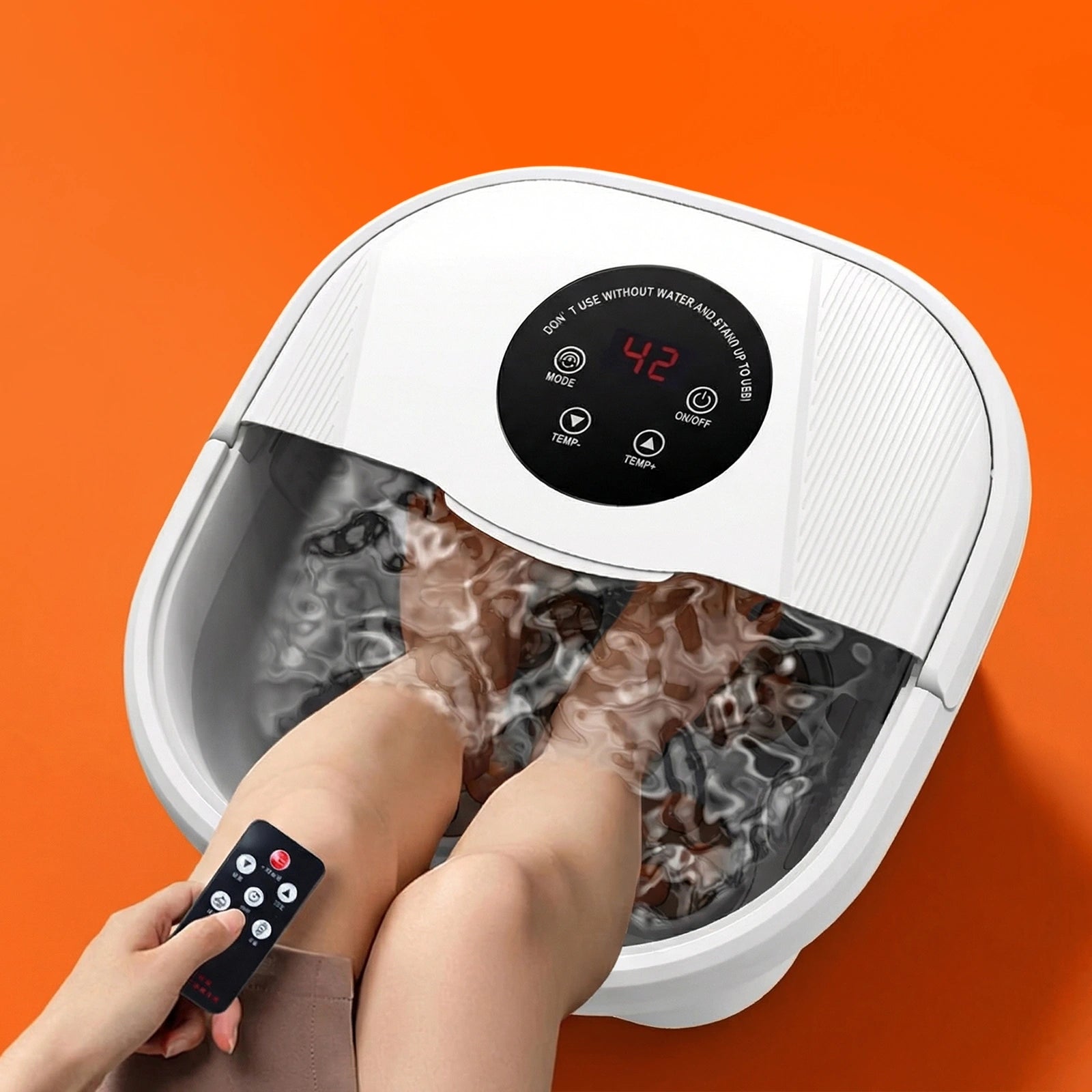 Foot spa with a white exterior, digital control panel, and water-filled basin, featuring feet submerged in warm water.