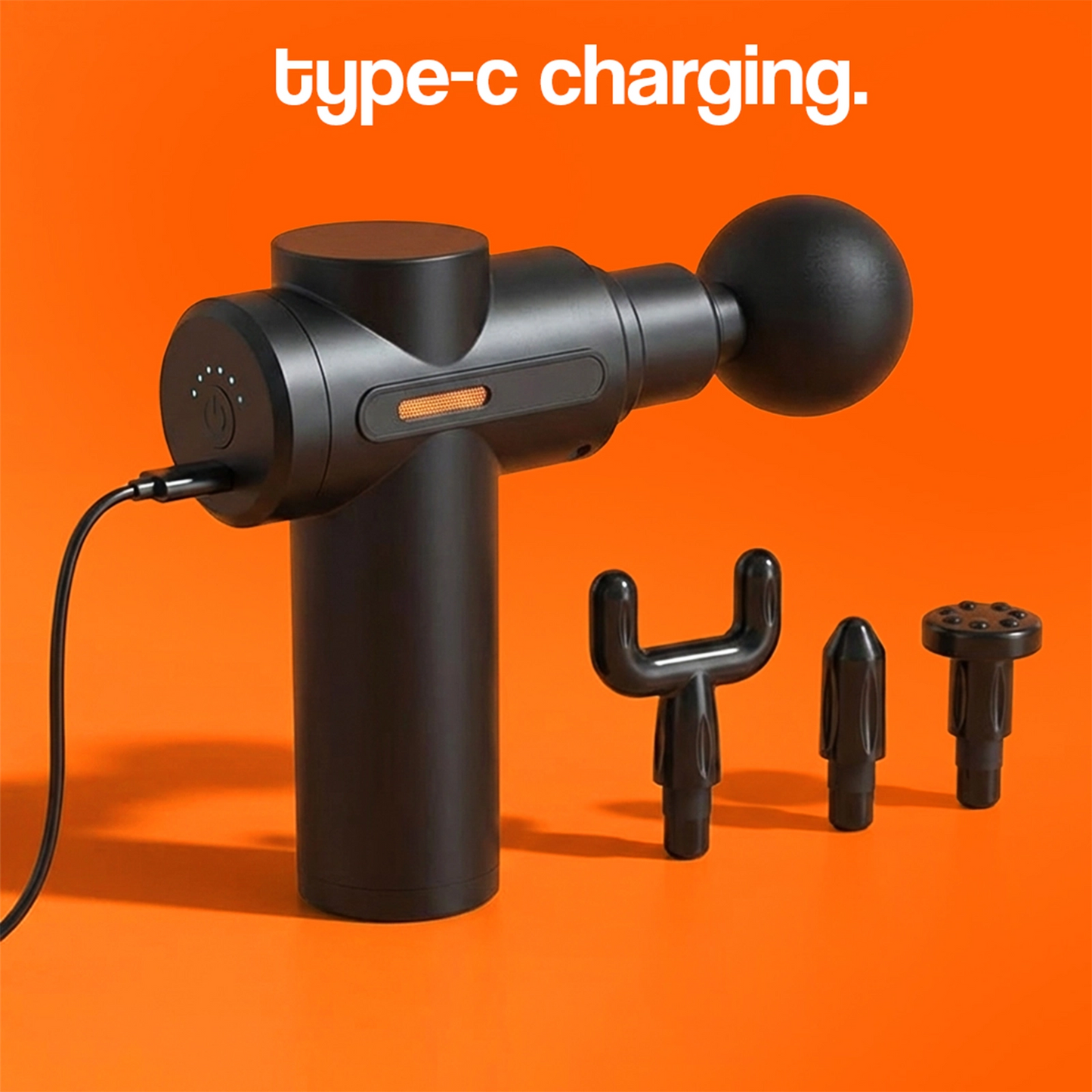 Black massage gun with Type-C charging cable plugged in on orange background.