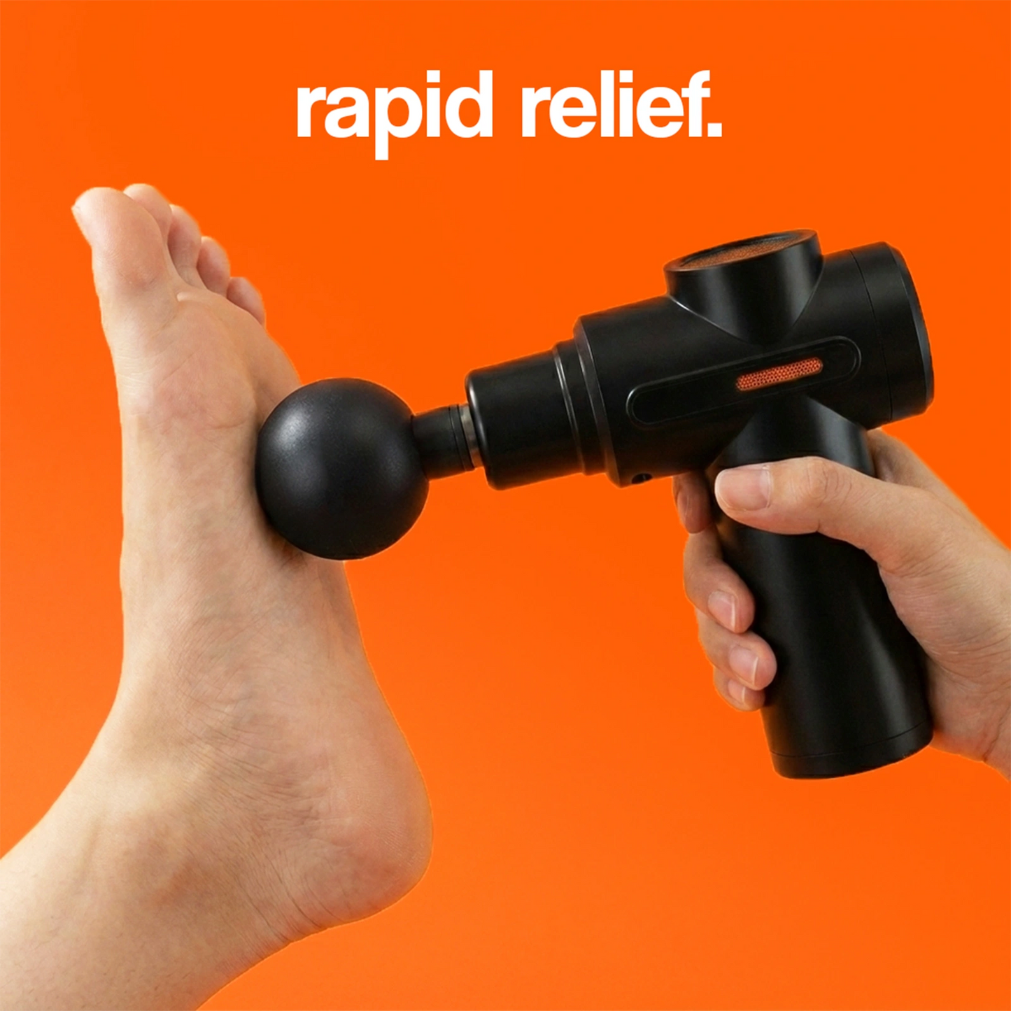 Black massage gun being applied to the arch of a foot for rapid relief.