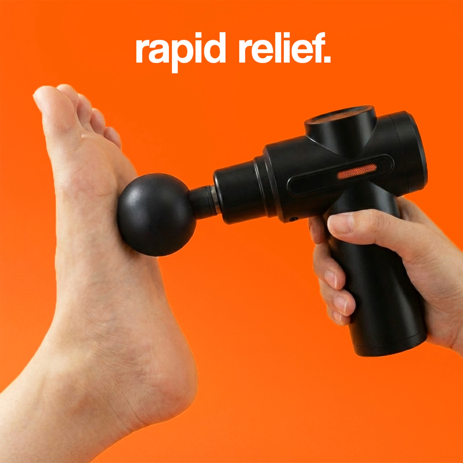 Black massage gun being applied to the arch of a foot for rapid relief.
